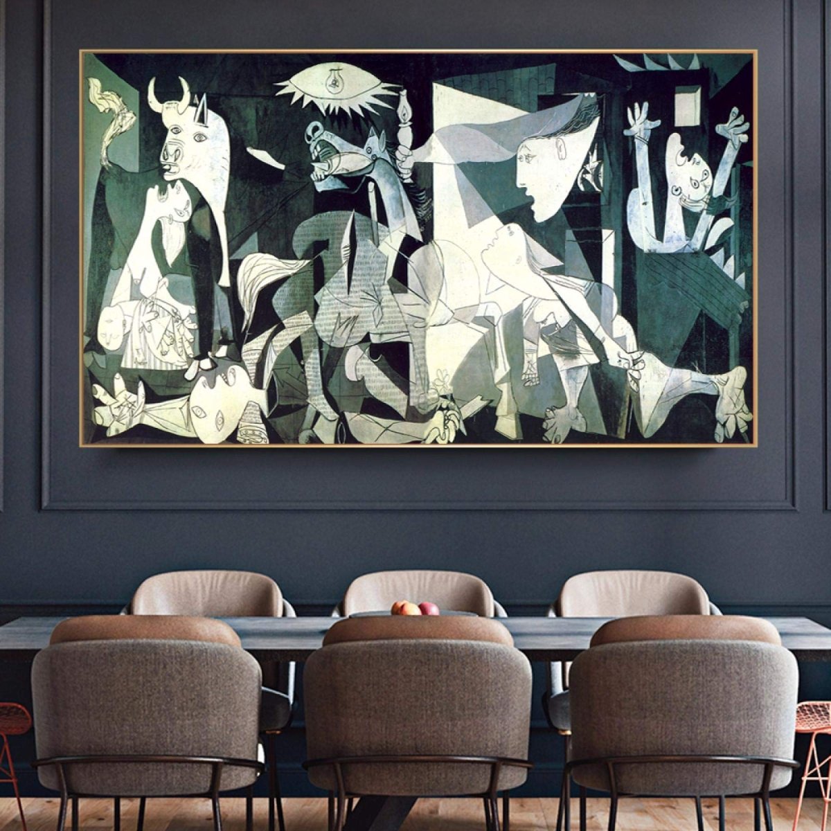Contextual mockup showing a framed print of Picasso's Guernica mounted above a modern console cabinet in a contemporary living room setting.