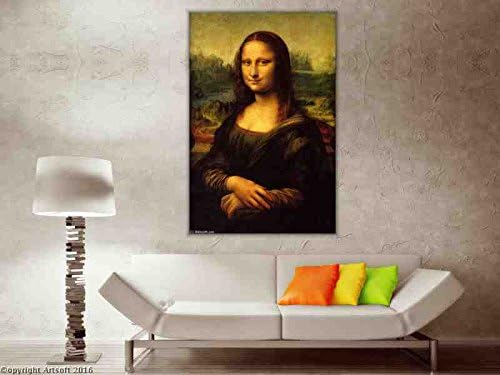Editorial interior lifestyle shot of the framed Mona Lisa hanging elegantly on a minimalist grey wall above a modern white lounge daybed.