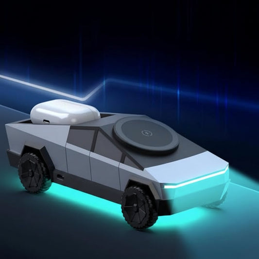 Futuristic Cybertruck wireless charger illuminated with ambient blue and green underglow on a dark background.