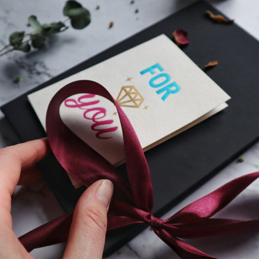 GIFT CARD WITH WISHES AND RED RIBBON
