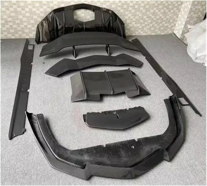 Detailed technical shot showing the sleek carbon fiber side skirt and aerodynamic components of the Lamborghini on display.