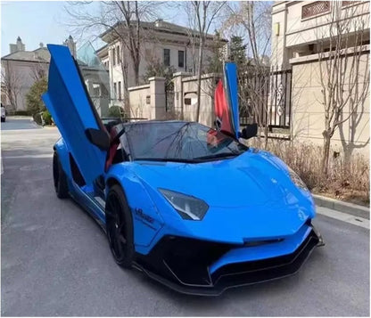 Front view of the striking blue Lamborghini Aventador supercar parked on a desert highway at sunset, with dramatic lighting.