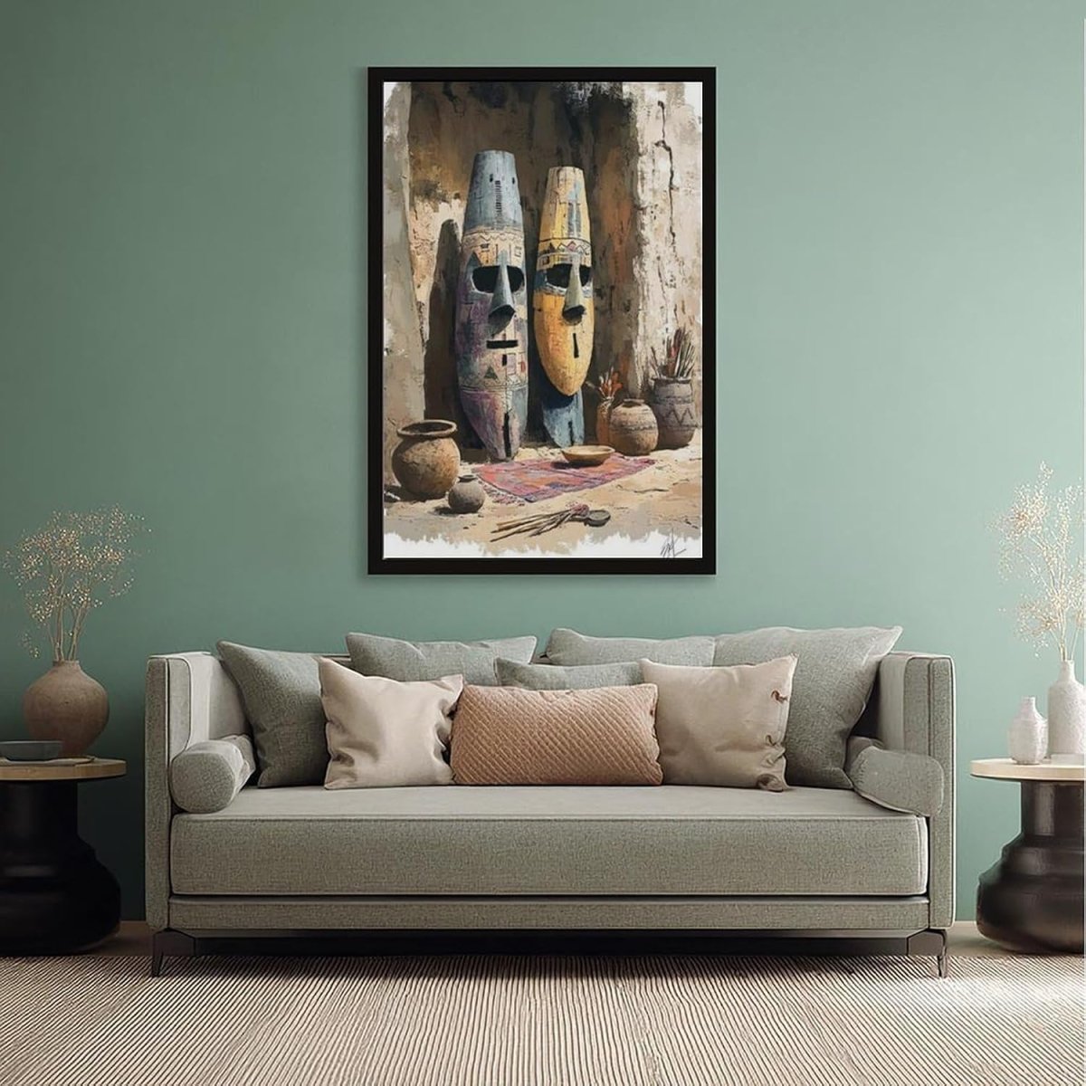 Wide-angle room view showing the framed African masks print hanging on a light wall in a contemporary study, visible behind a sofa.