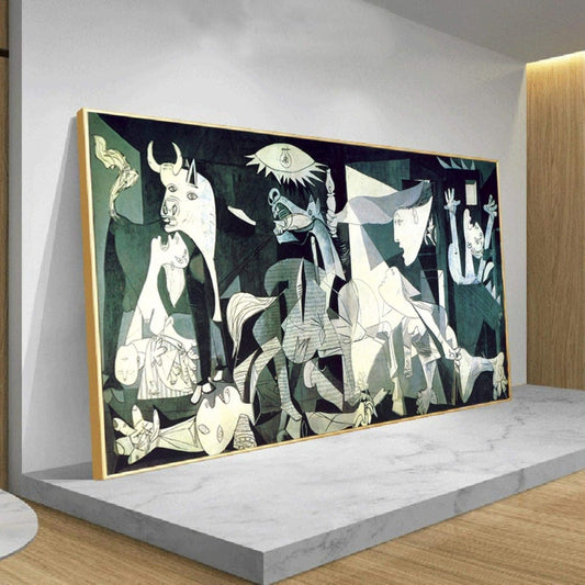 Framed mockup of Picasso's Guernica hanging on a clean, minimalist gallery wall, viewed in perspective with a slight angle.