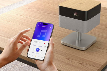 Close-up shot of a smartphone controlling the wireless levitating projector via a mobile app.